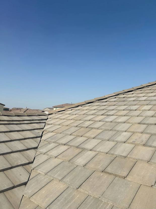 Concrete tile reset over the newly installed underlayment on a Tucson roof