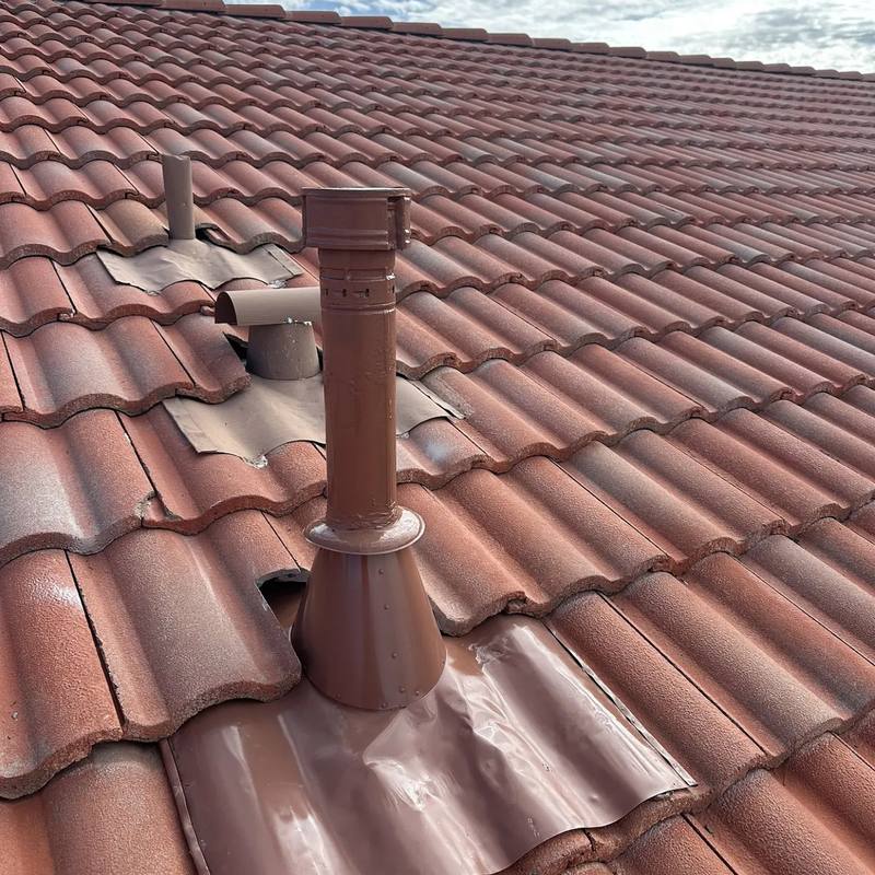 The same vent pipe after SolTerra installed new flashing and reset the tile