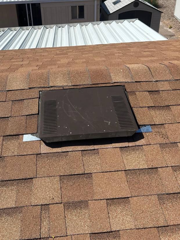 Completed roof vent installed and sealed into the surrounding shingles